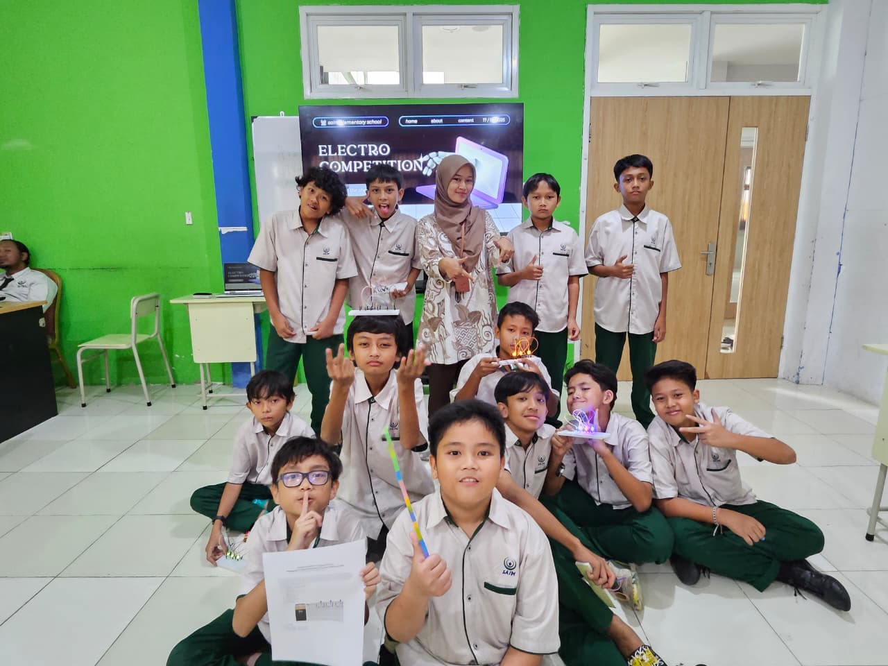 Children aged 6–8 learning coding