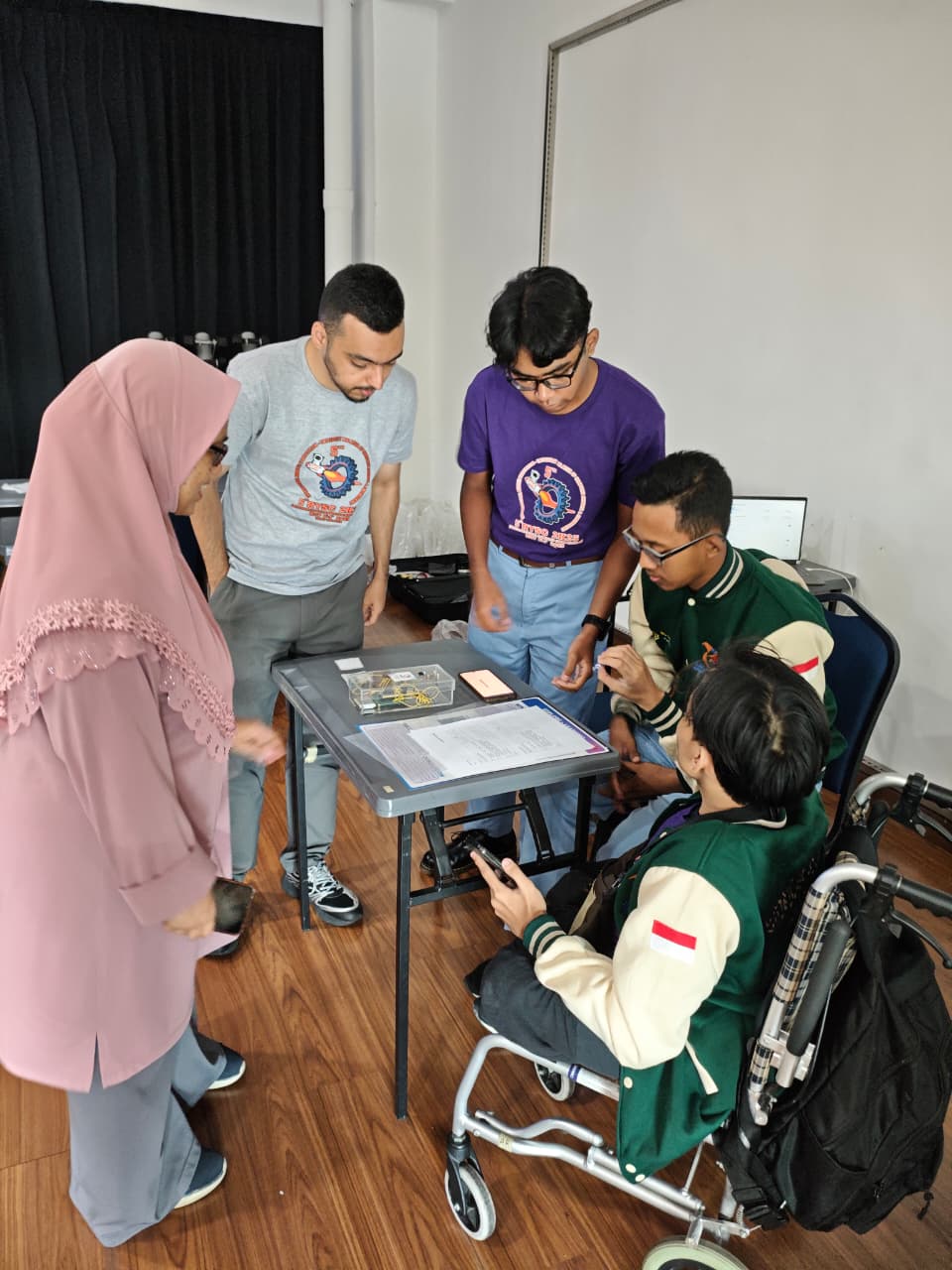 Teenagers aged 12–16 learning coding